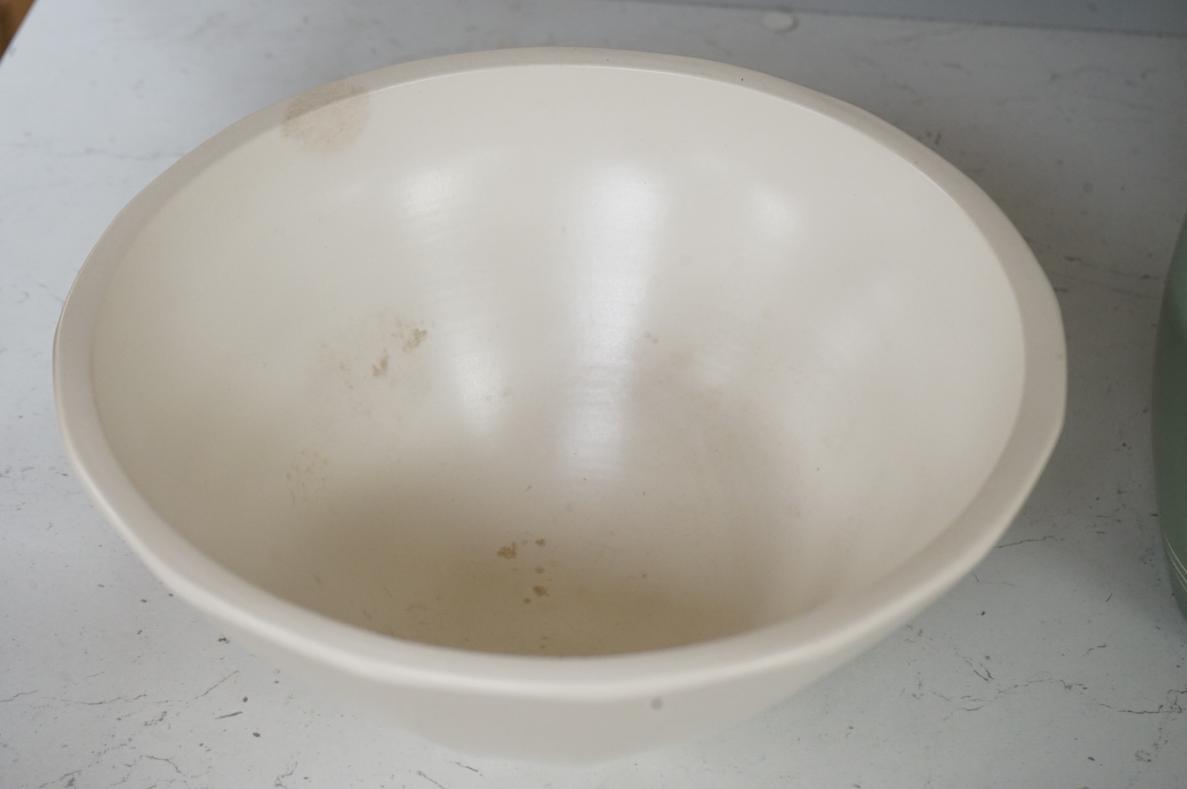 Keith Murray for Wedgwood, a cream conical bowl, 25cm diameter